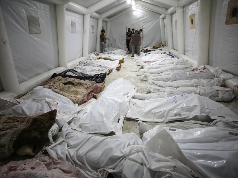 Gaza health ministry says hundreds killed in strike on al-Ahli hospital in Gaza City, showing destruction and rescue efforts Rubble and chaos at Gaza hospital following strike that killed hundreds, according to Gaza health ministry