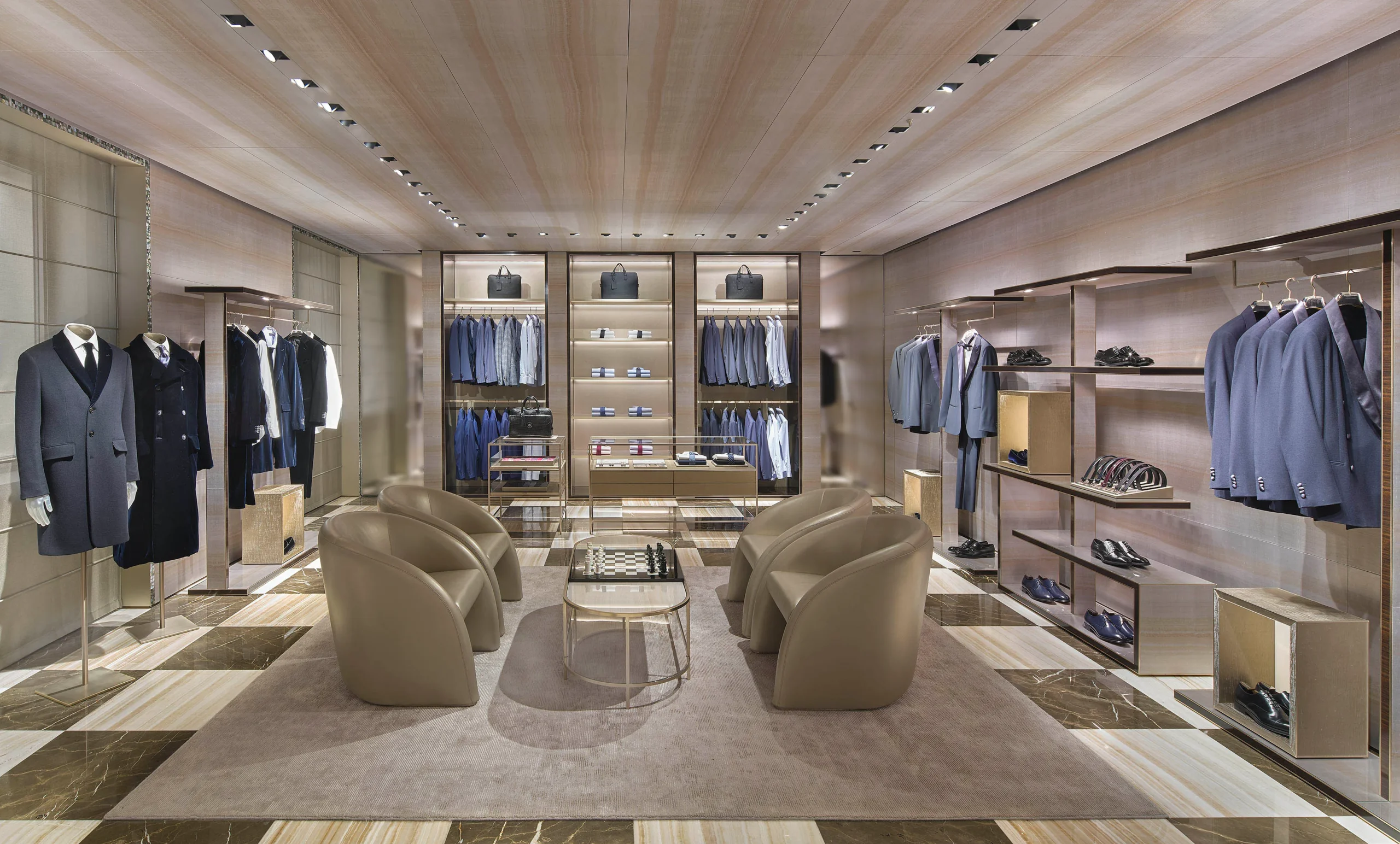 Giorgio Armani flagship storefront on Via Montenapoleone in Milan at dusk, window display of tailored suits and accessories Giorgio Armani flagship storefront on Via Montenapoleone in Milan at dusk, window display of tailored suits and accessories