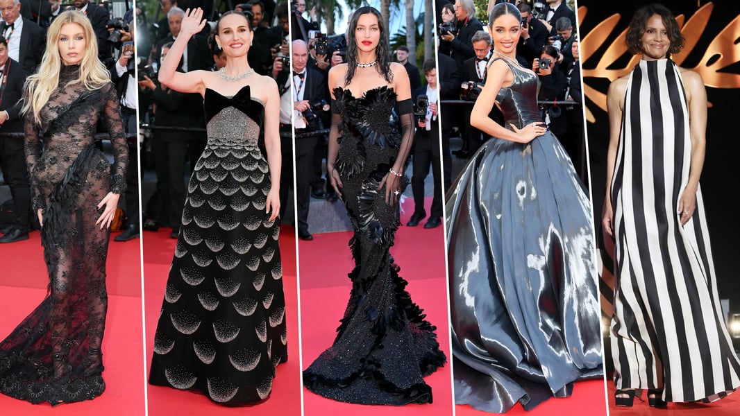 Celebrities posing for photographers in stylish evening wear