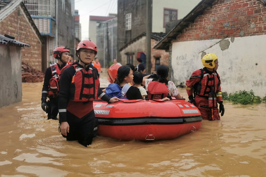 Rescue Teams Evacuate Residents In Beihai Emergency workers assist evacuees in Beihai, Guangxi, amid floodwaters linked to Ragasa’s rain bands.