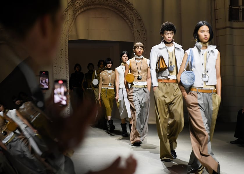 Models showcase Coach NYFW SS26 baggy jeans and workwear collection on the runway