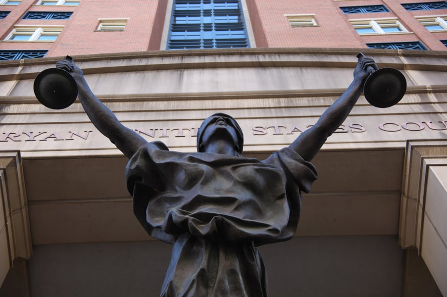 Entrance of the Albert V. Bryan U.S. Courthouse with statue