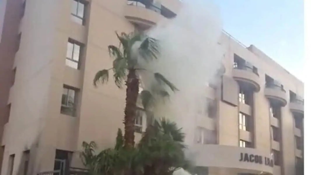 Medics treat civilians after a drone strike in Eilat