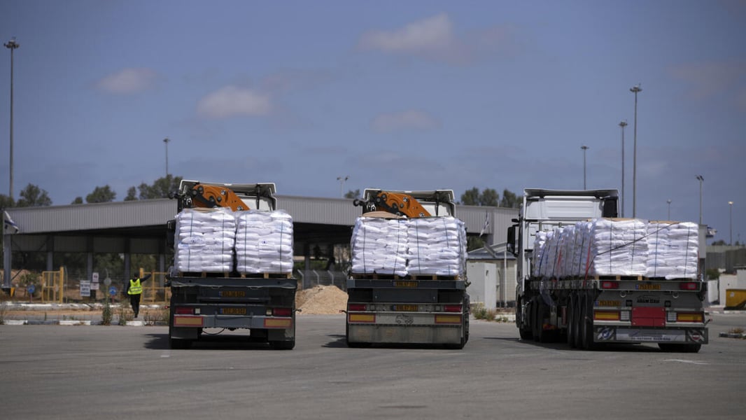 Aid Convoys Queue At Gaza Crossing Aid trucks queue at a Gaza crossing amid access restrictions