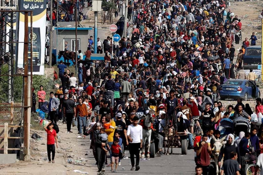 palestinian families fleeing gaza amid bombardment with children and elderly seeking safety