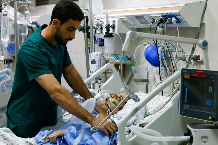 Medical staff triage the wounded in a Gaza City hospital running on generators