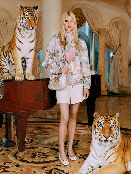 Still from Gucci’s short film “The Tiger” showing the family dinner scene