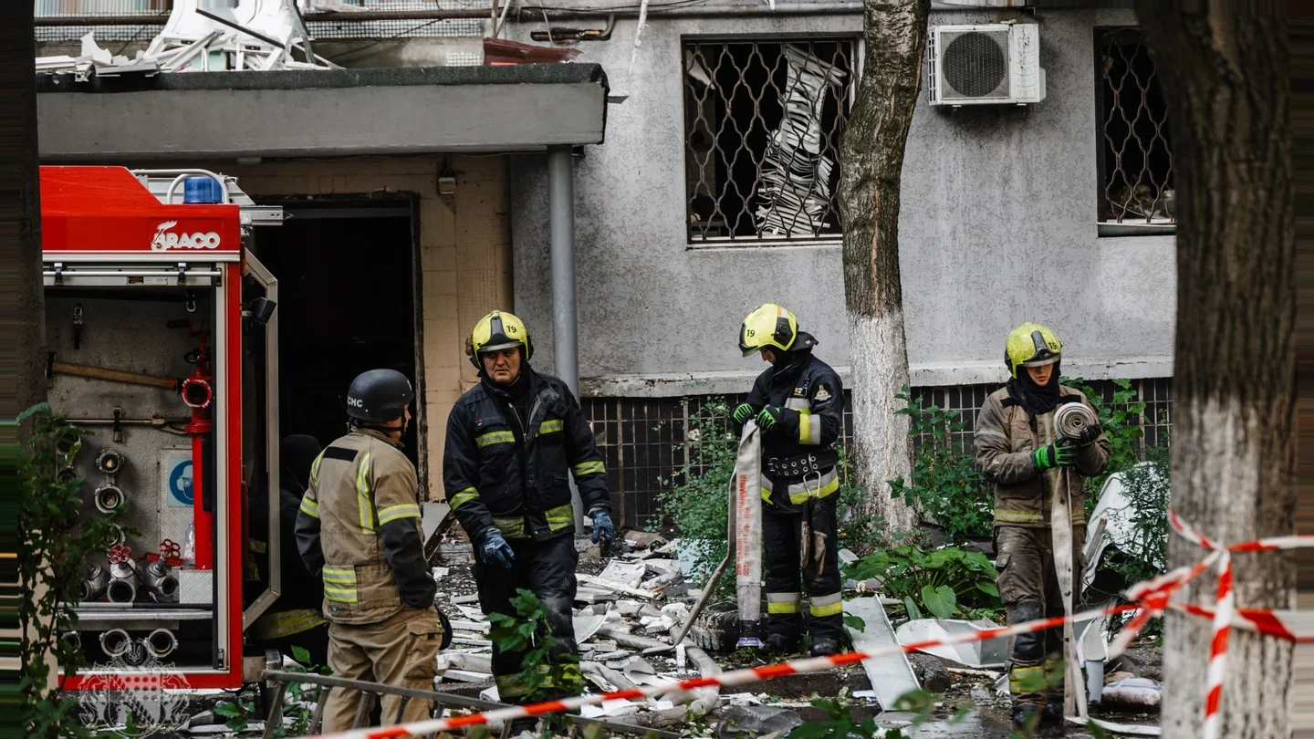 Rescue workers in Kyiv inspect damage after overnight drone and missile interceptions