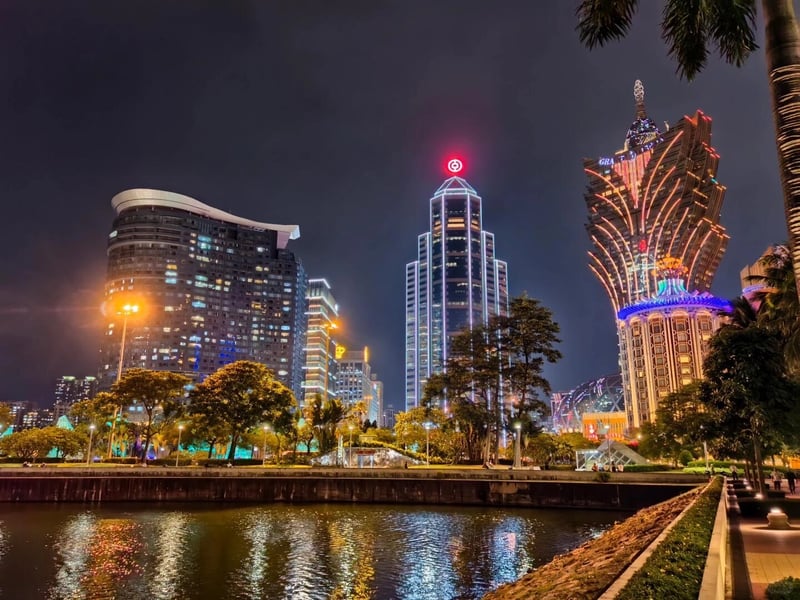 Venetian Macao lights up Cotai at peak season The Venetian Macao at night reflected on the water in Cotai