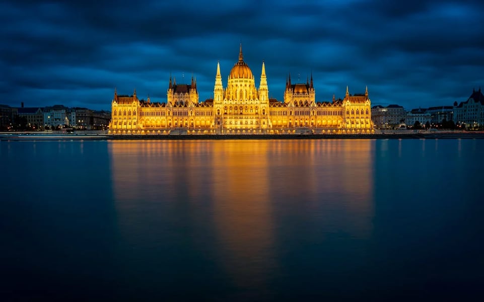 Hungarian Parliament Building illuminated at night on the Danube in Budapest