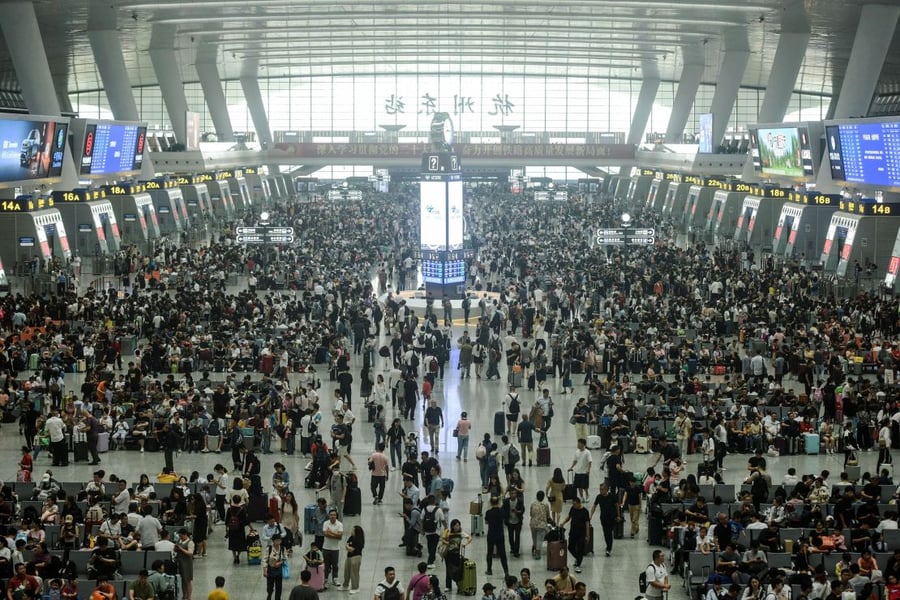 Passengers crowd a major railway station in China at the start of Golden Week Passengers crowd a major railway station in China at the start of Golden Week