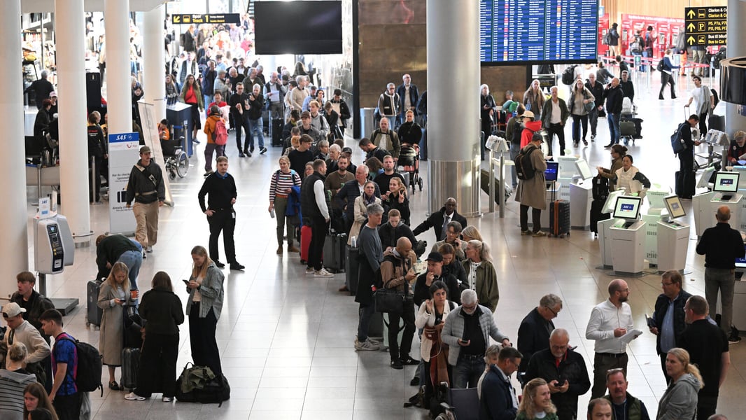 Drone sightings halt flights in Copenhagen Passengers wait at Copenhagen Airport during drone disruption