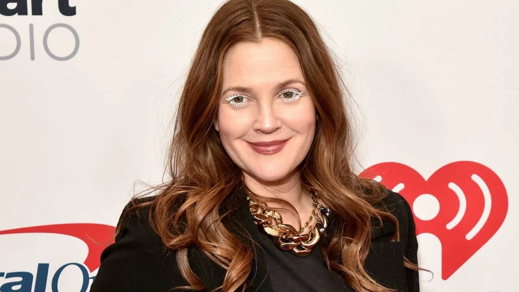 Drew Barrymore smiles in a studio portrait from “The Drew Barrymore Show”