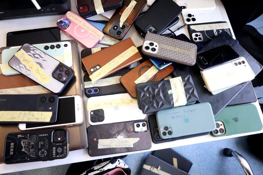 Seized phones and laptops from Lagos cybercrime raids tied to romance scams and phishing operations