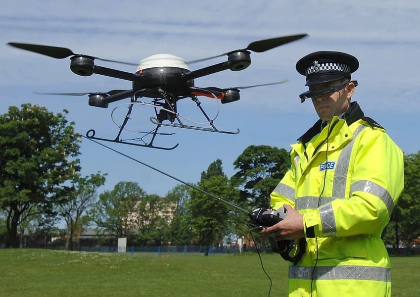 Police at a European airport check counter-drone gear during a drone alert