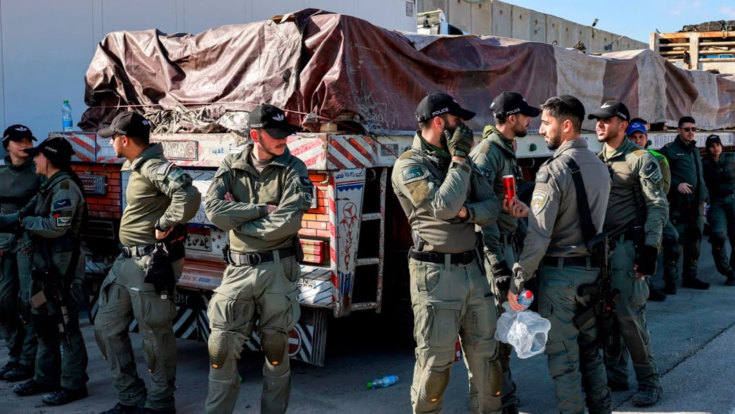 Aid trucks waiting for inspection at the Kerem Shalom crossing during the Gaza ceasefire