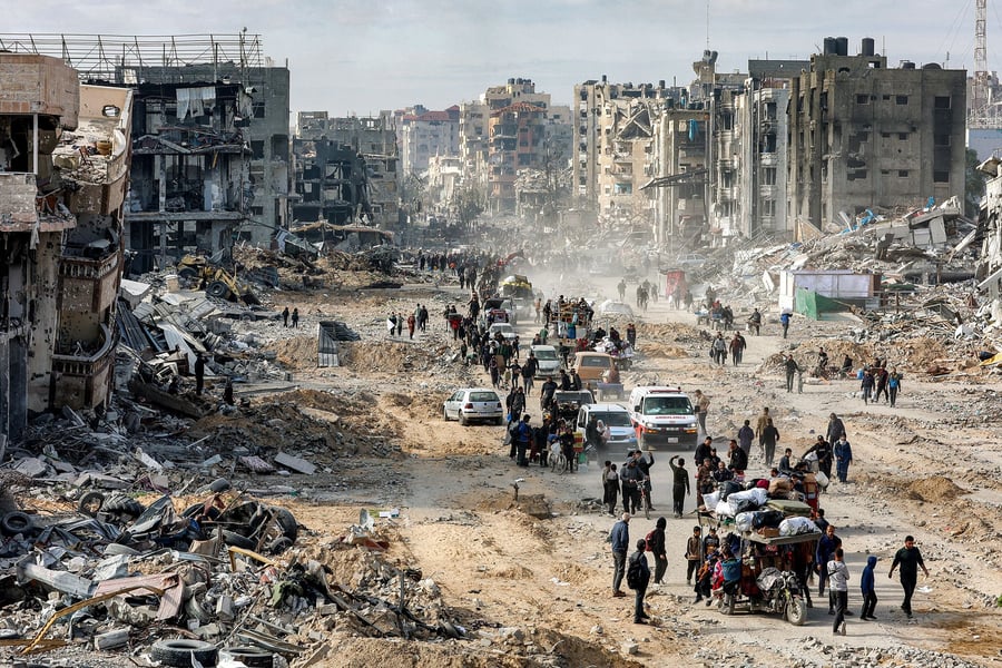Residents walking through destroyed streets in Jabalia during the ceasefire