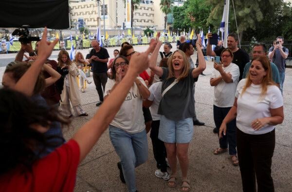Israelis celebrate after news of the first-phase truce at Hostages Square in Tel Aviv