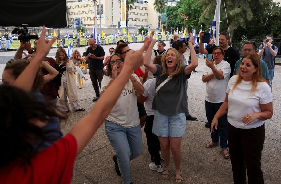 Israelis celebrate after news of the first-phase truce at Hostages Square in Tel Aviv