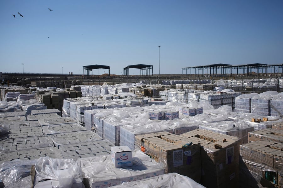 Pallets of boxed aid loaded inside a truck at Kerem Shalom