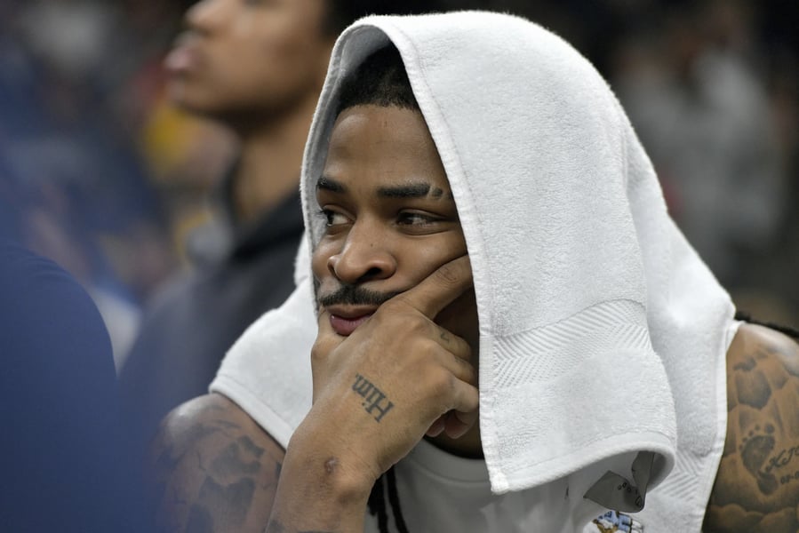 Ja Morant in action at Memphis Grizzlies vs Warriors 2025 Game Ja Morant driving to the basket for Memphis Grizzlies in 2025 NBA game