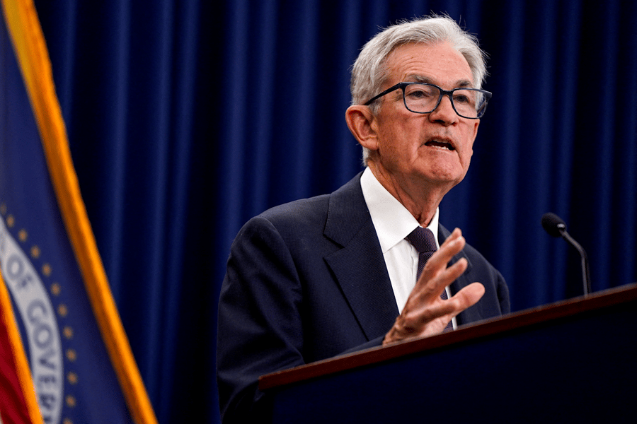 Jerome Powell Federal Reserve Chair announces interest rate decision at press conference, signaling pause in rate cuts