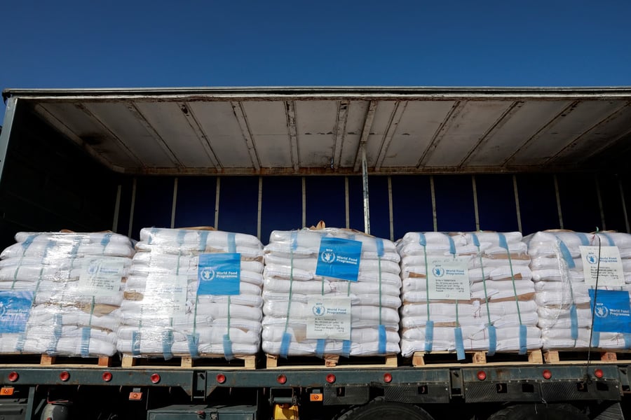 Pallets of relief supplies seen inside a trailer at Kerem Shalom crossing