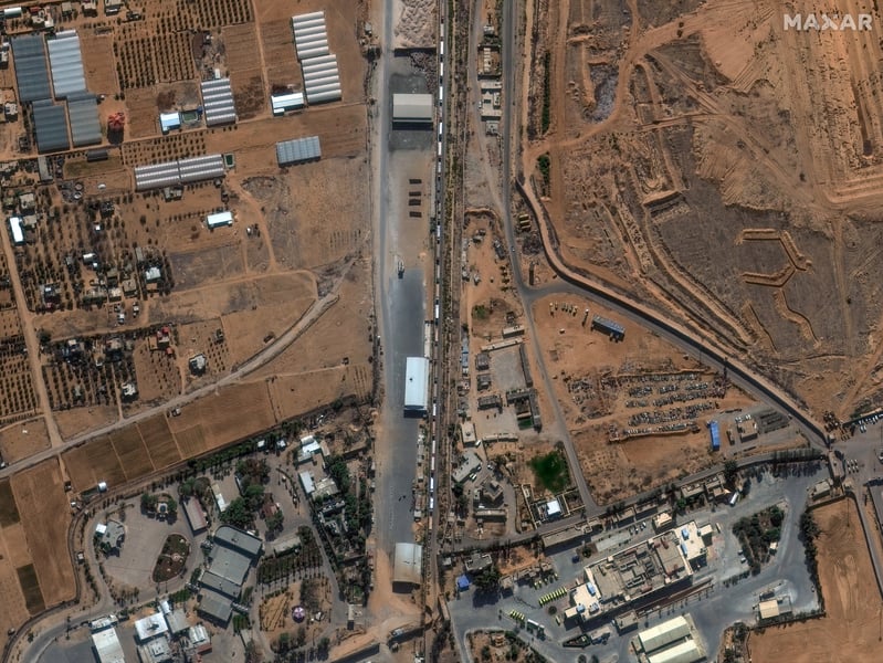 Satellite image shows aid trucks queued near Kerem Shalom while inspections proceed