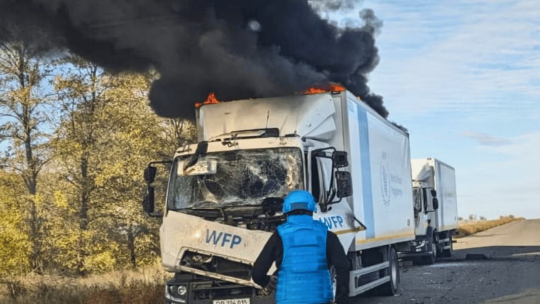 Burned aid trucks from a UN convoy near Bilozerka following a reported drone attack.