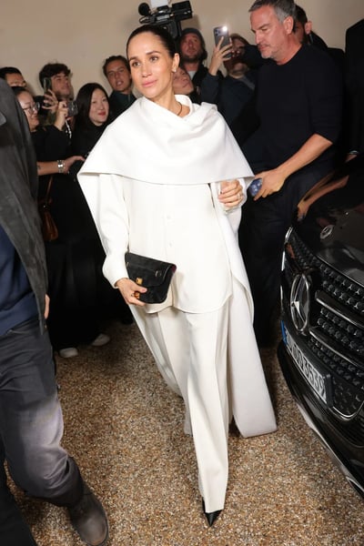 Meghan Markle in a white cape at the Balenciaga show, front row at Paris Fashion Week 2025.