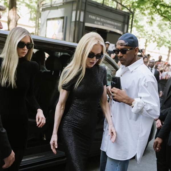 Nicole Kidman in Paris, black dress street style Nicole Kidman in a black dress holding an umbrella outside a Paris venue