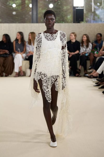 Runway look in Paris showing lined sheer panels and architectural tulle