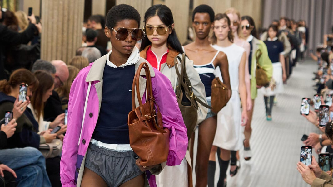 Model in Miu Miu Fall 2025 walking at Paris Fashion Week, highlighting brand momentum