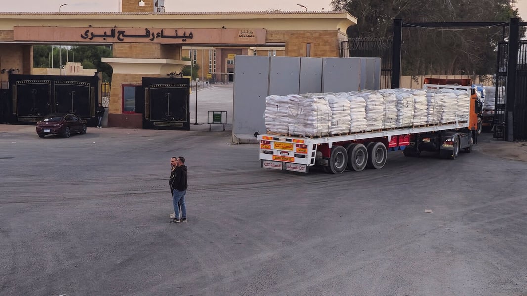 Aid trucks queue near Rafah crossing as the Gaza truce wavers