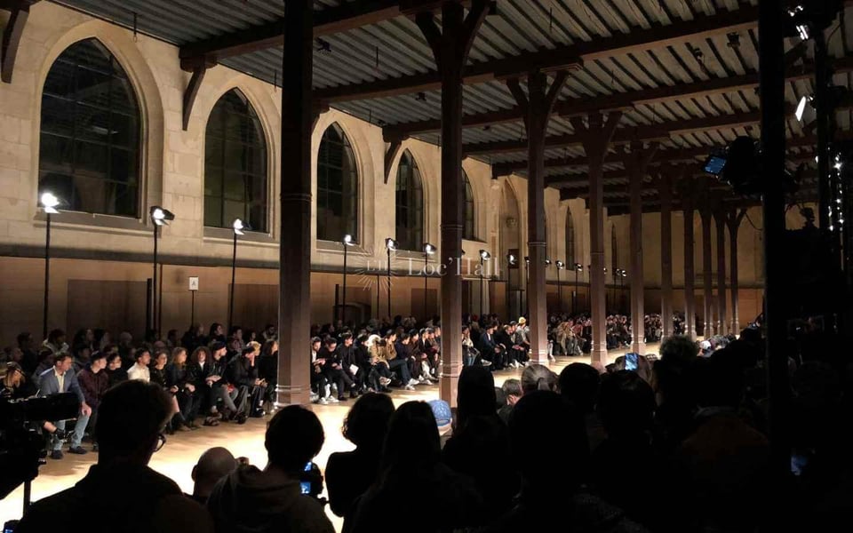 Interior of the Réfectoire des Cordeliers in Paris, long hall with stone arches used for fashion shows.