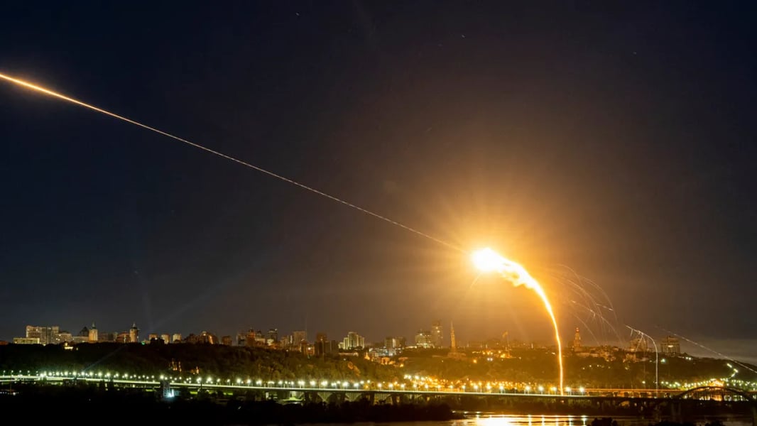 Russian air defenses counter drone raids Light trails from Russian air defenses intercepting inbound drones at night