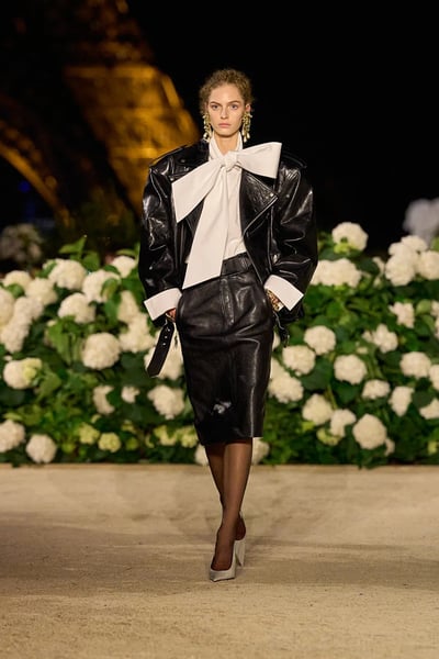 Close-up of Saint Laurent Spring 2026 black leather jacket with power shoulder and beveled lapel