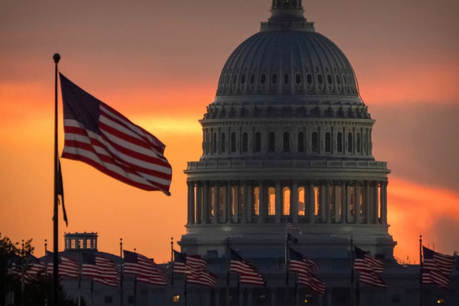 Capitol dome lit at dusk during a federal funding lapse