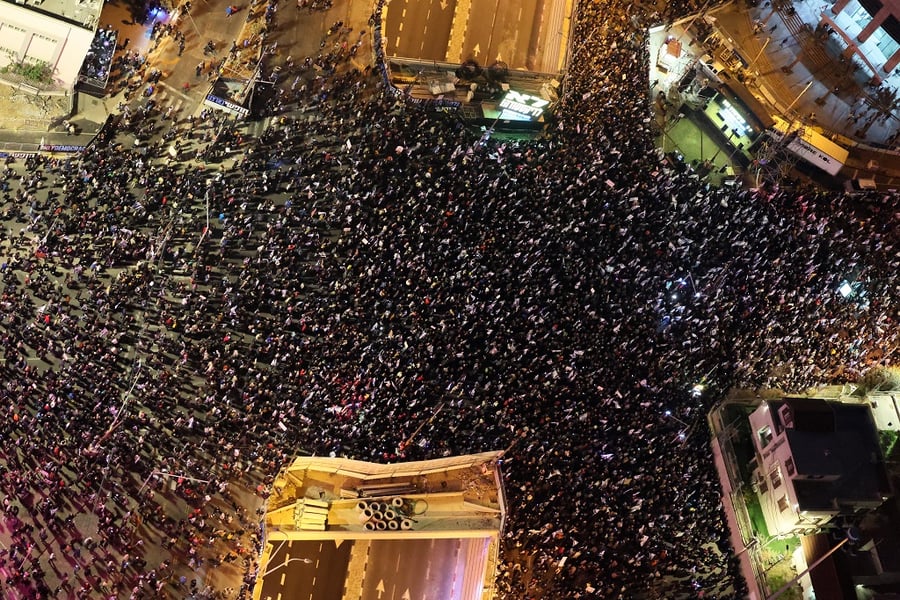 Drone view of Hostage Square protest in Tel Aviv with families holding signs