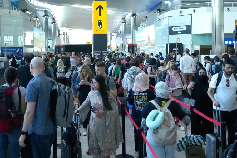 Travelers queue at TSA security as the shutdown strains staffing