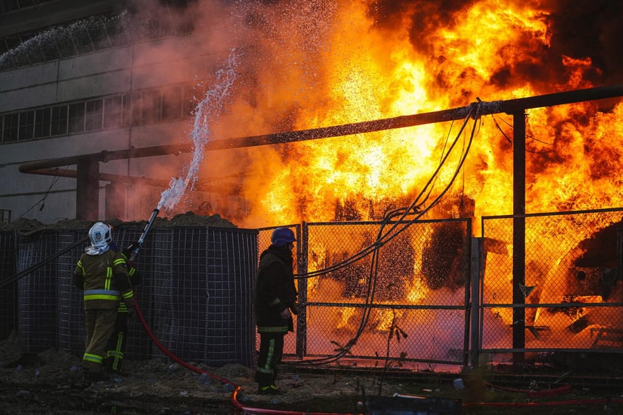 Firefighters work at a damaged power substation after pre-dawn strikes in Ukraine