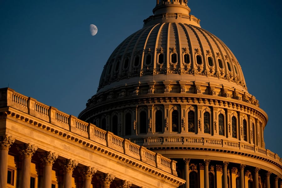 U.S. Capitol at dusk as the federal government shutdown enters Day 2