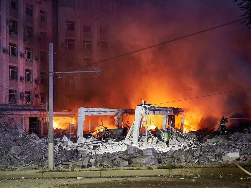 Damaged Apartment Building in Dnipro Firefighters battle flames at nine-story apartment building in Dnipro hit by Russian drone