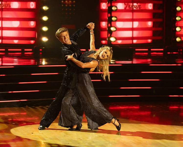 Robert Irwin and Witney Carson celebrating DWTS Season 34 Mirrorball Trophy win