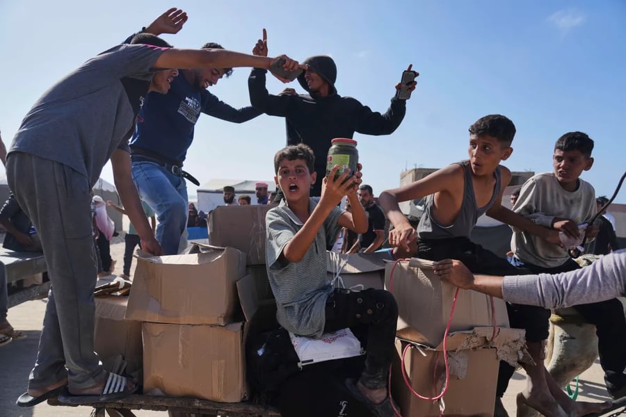 Gaza Aid Distribution Amidst Collapse Aid workers delivering essential supplies in Gaza during humanitarian crisis
