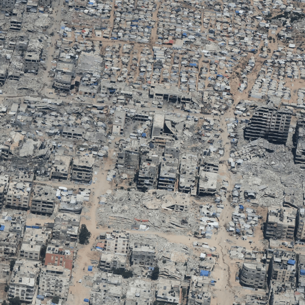 Aerial view of Gaza showing destruction and civilians awaiting aid during Israel-Palestine conflict day 721