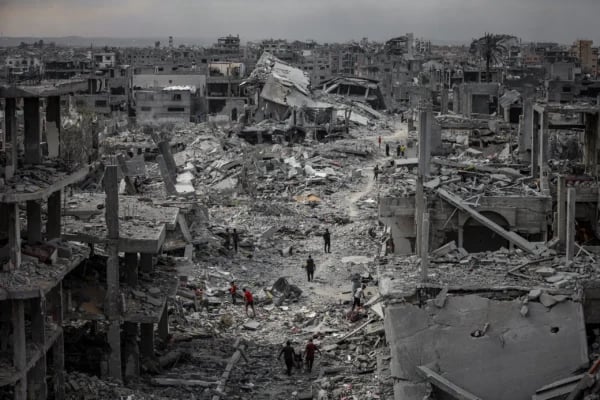 Gaza Day 716 devastation with destroyed buildings and civilians amid rubble