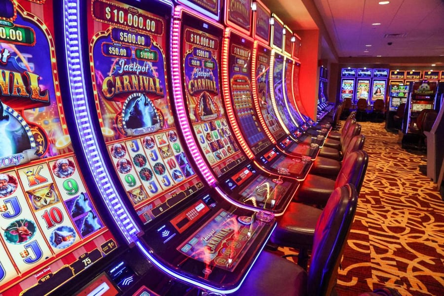 Gaming floor at Horseshoe Indianapolis Casino showing slot machines and table games where dealers earn $5-7 per hour plus tips