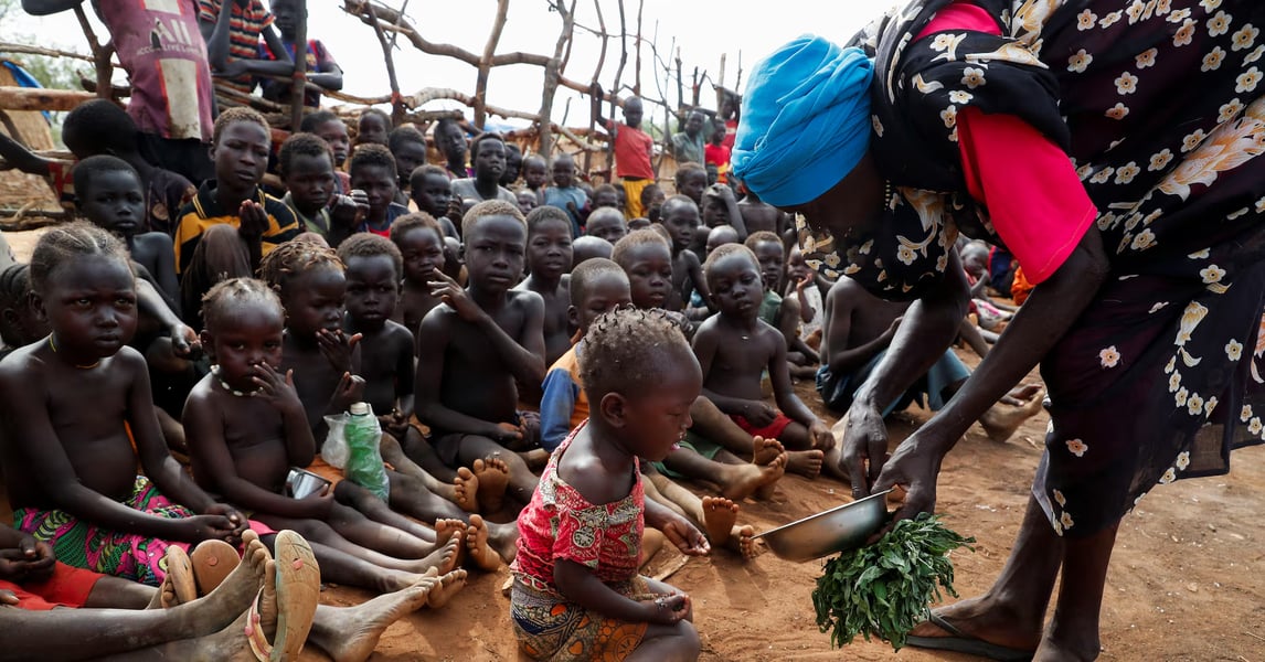 Humanitarian aid workers distributing food and medical supplies to displaced families in Kordofan, Sudan, 2025