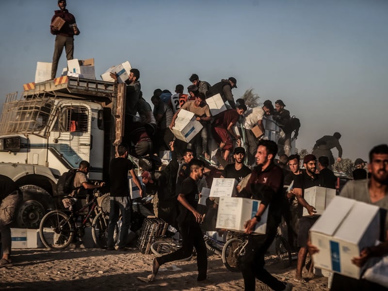 Aid trucks near Gaza blockade amid humanitarian crisis, 2025 Humanitarian aid trucks attempting delivery near Gaza blockade in 2025